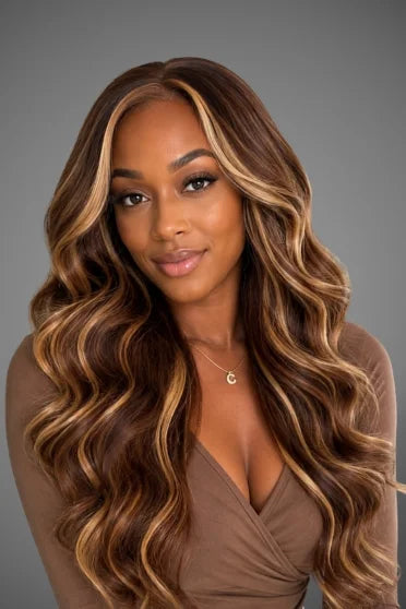 4/27 Honey Blonde Ombre Body Wave HD Lace Frontal Wig - woman with long wavy highlighted brown hair wearing brown top
