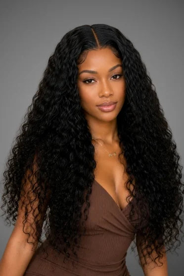 30"-40" Curly HD Lace Front Deep Wave Wig - woman with long voluminous black curly hair wearing brown wrap top